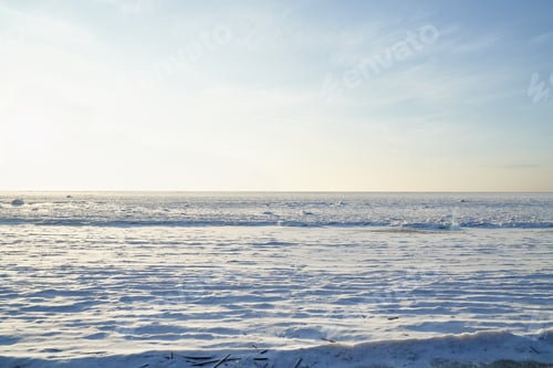 Preview: Winter landscape with clear sky and snow cover of ice on reservoir of lake on bay