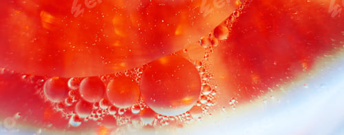 Preview: Oil bubbles close up. circles of water macro. abstract orange and fiery red background. banner
