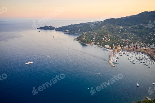Preview: Aerial view of a marina with yachts and boats. Reflection of sun rays in the water Ligurian sea at