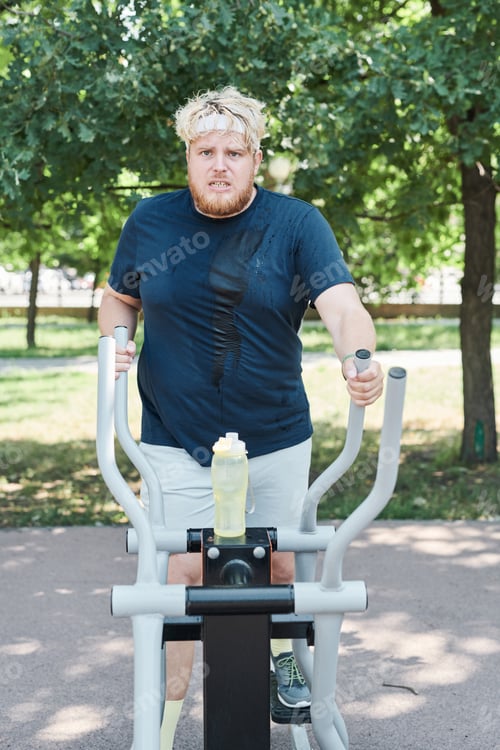 Preview: Man exercising on sports equipment