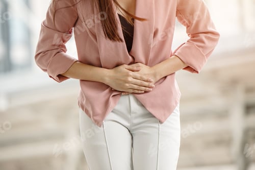Preview: Office woman holding belly with menstrual pain, stomach cramping, hurt diarrhea abdominal problem