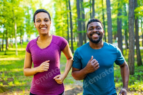 Preview: Fit young african american couple in sport activity outdoors runs in morning