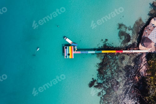 Preview: Wooden bridge at the beach and clear blue water