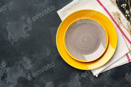 Preview: Top view of ceramic plate with table napkin on gray background