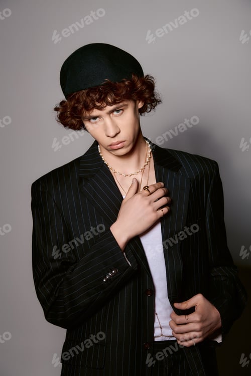 Preview: Stylish young man models a fashionable outfit with confidence and flair