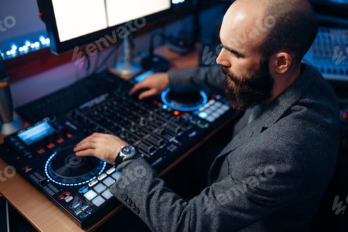 Preview: Male sound editor in the recording studio