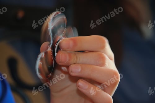 Preview: Hand holding a moving fidget spinner