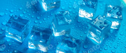 Preview: Ice cubes on a blue background. Selective focus.
