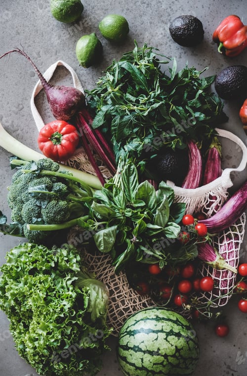 Preview: Fresh vegetables, greens and fruits over concrete kitchen counter
