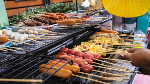 Preview: Simple street food in Bangkok, Thailand, meatballs, sausages, grilled squid on a stick