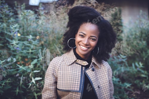 Preview: Beautiful african american woman in a spring park