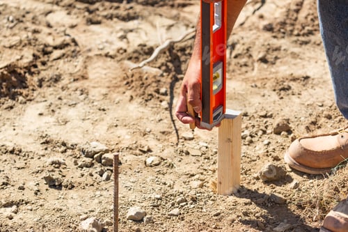 Preview: Worker Using Level At Construction Site
