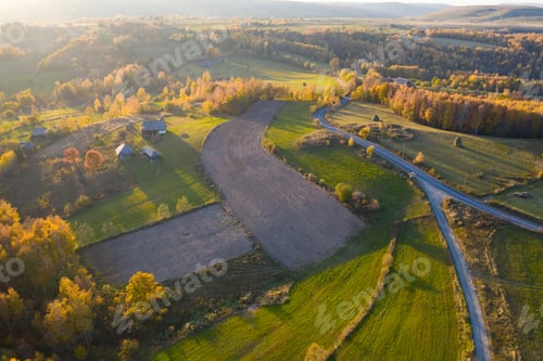 Preview: Aerial view of beautiful autumn hills and colorful forest from a drone. Transylvania, Romania