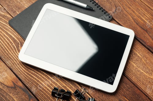 Preview: Tablet with notepad on wooden background
