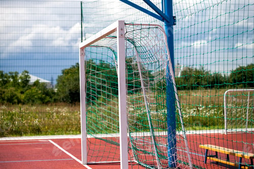 Preview: Soccer or football field playground with bright red soft rubber flooring