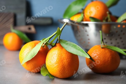 Preview: Tasty ripe tangerines on table. Citrus fruit