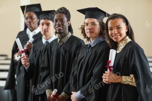 Preview: Group of people in graduation gowns posing
