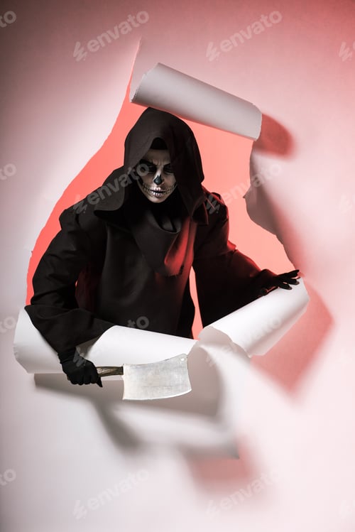 Preview: woman in death costume holding cleaver and getting out of hole in paper