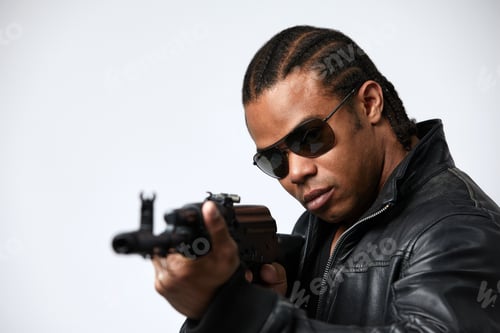 Preview: A black African American police detective man on the job with a gun