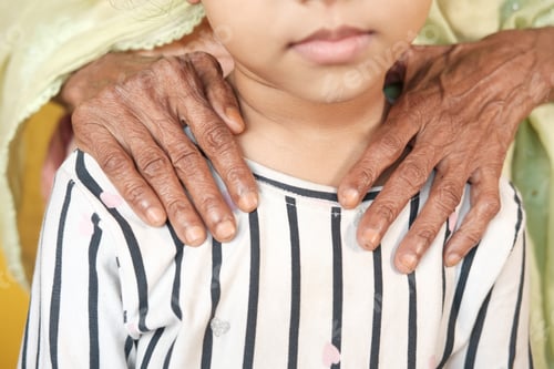 Preview: senior women putting her hands on child's shoulder