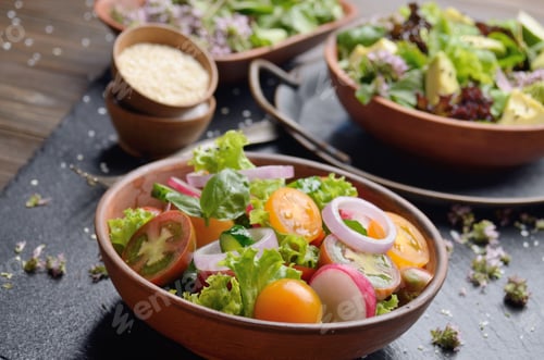 Preview: Vegetable salad of lettuce, cherry tomatoes, radish, cucumber, o