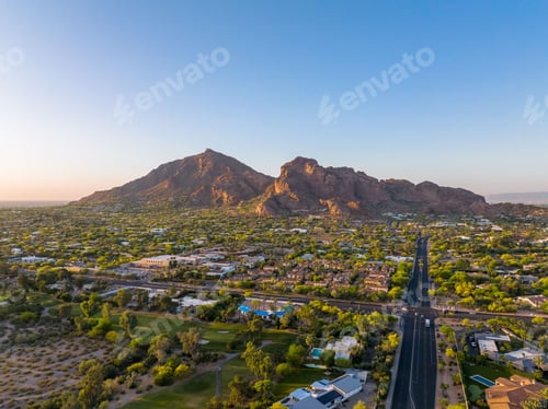 Preview: Camelback Mountain at sunrise in Phoenix, Arizona golf course and luxury homes