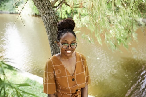 Preview: Black Young Woman in Park