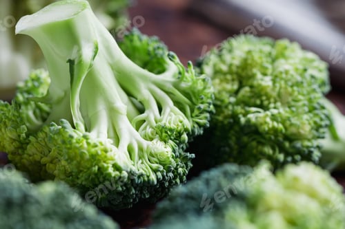 Preview: Close-up of a fresh broccoli on a cutting board. The concept of vegetarian and healthy food.