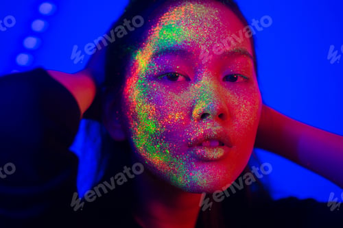 Preview: Fashion model with fluo painting on the face