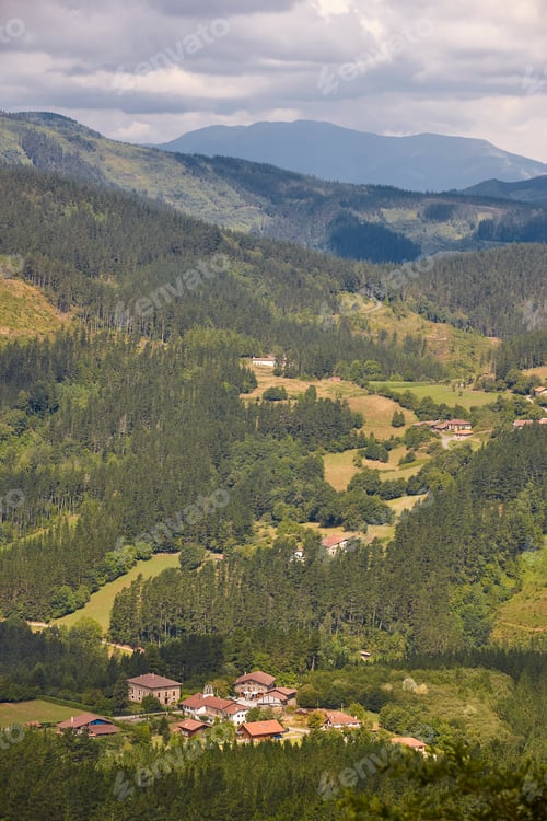 Preview: Basque country valley surrounded by forest and mountains. Spanish tourism