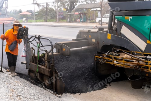 Preview: Machines are pouring asphalt to build roads for cars.