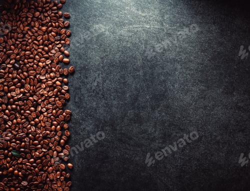 Roasted Coffee Beans on Dark Textured Background
