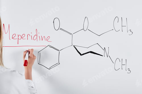 Preview: cropped view of woman writing meperidine on white board