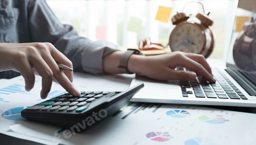 Preview: Close up Businesswoman using calculator and laptop for calaulating finance, tax, accounting