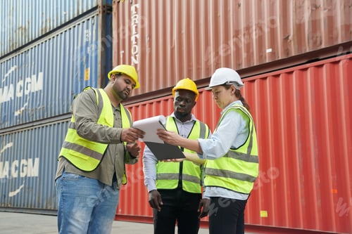 Preview: Foreman control loading Containers box from Cargo freight ship for import export.