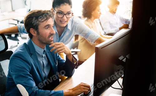 Preview: Creative people working in office on computer