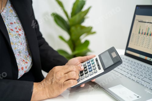 Preview: Asian accountant working and analyzing financial reports project accounting with labtop and