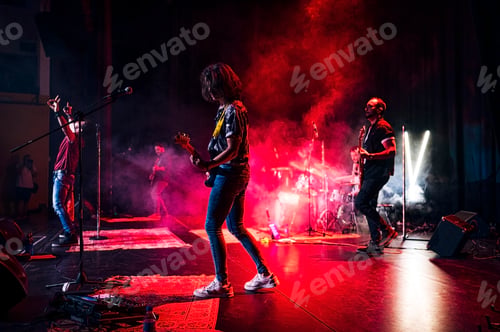 Preview: Rock and roll group performing live.