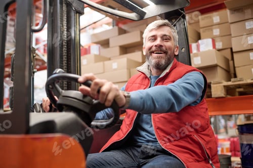 Preview: Warehouse worker operating a forklift