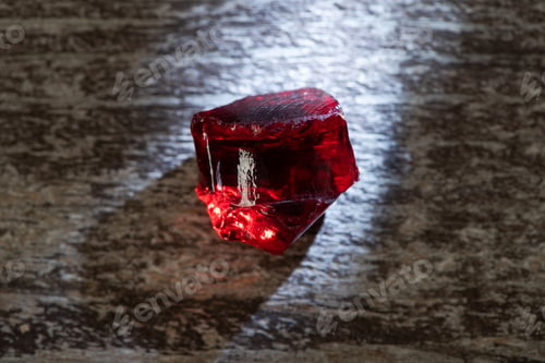 Preview: Top View of Magical Red Crystal With Light on Wooden Background