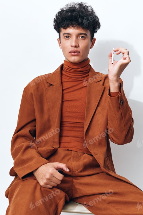 Preview: Man smoking cigarette portrait thoughtful hipster fashion beige sitting student lifestyle