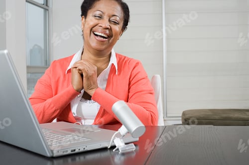 Preview: Mature woman using webcam