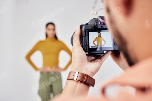 Preview: Camera, photography and photographer with woman fashion model in studio for creative, advertising a