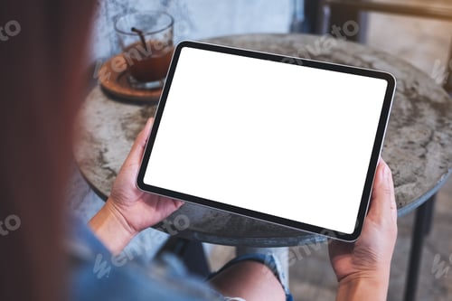 Preview: Mockup image of a woman holding digital tablet with blank white desktop screen