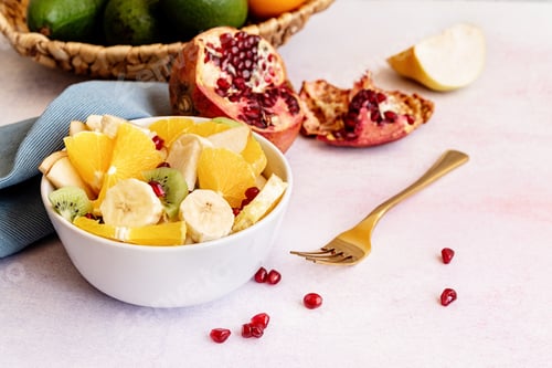 Preview: Healthy dieting. Close up of fresh fruit salad on white marble background
