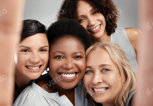 Preview: Shot of a diverse group of women standing close together in the studio and take a selfie