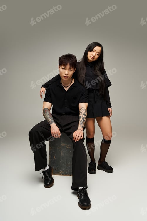 Preview: Stylish couple displaying love and romance against a minimalist backdrop