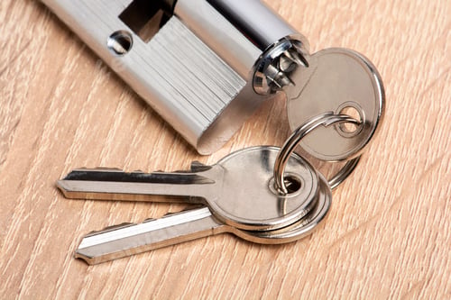 Preview: Door lock on wooden background