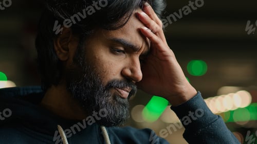 Preview: Arabian unhappy bearded man unhealthy guy feel stress anxious worried at parking lot headache