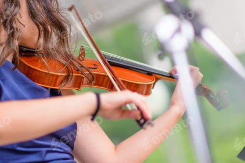 Preview: Girl rings violin in a show